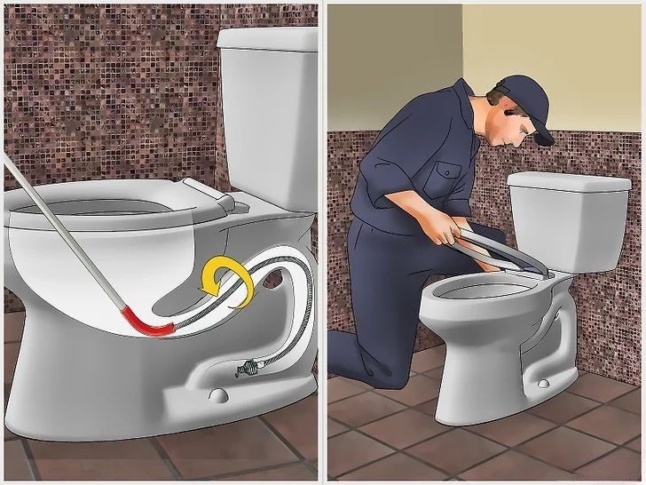 Cận cảnh đầu súng của máy nén khí thông tắc chuyên dụng đang được đặt vào miệng bồn cầu